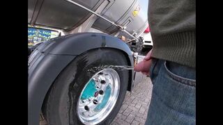 Pissing against a truck tire